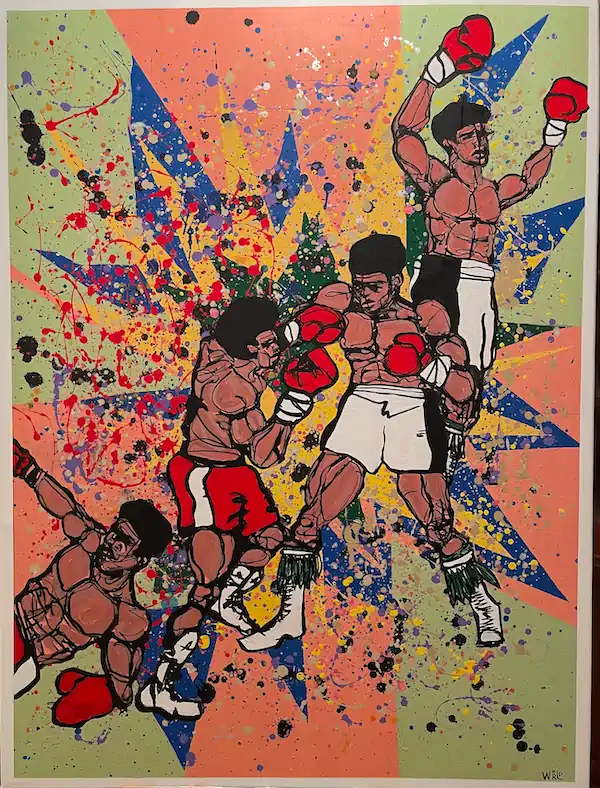 Painting depicts boxers in various poses, superimposed over a background of multi-colored paint spatter.