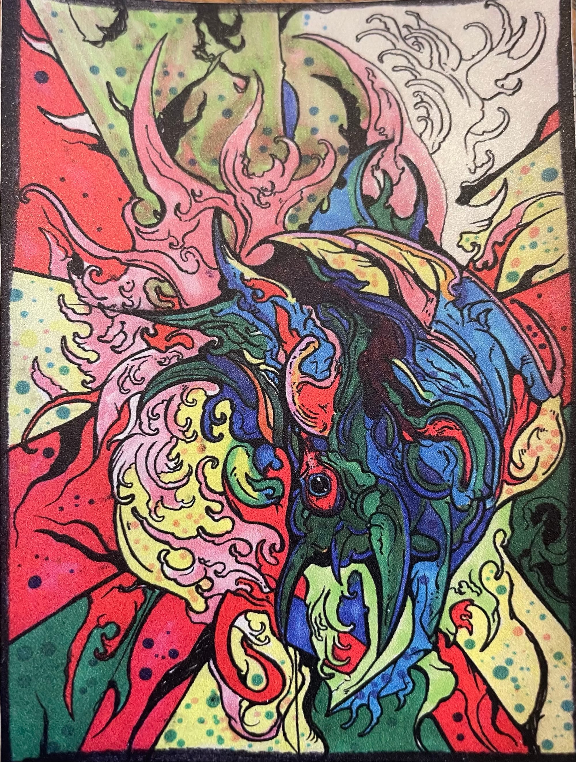 A muti-colored monster with claw-like beaks colored in a cartoonish style.