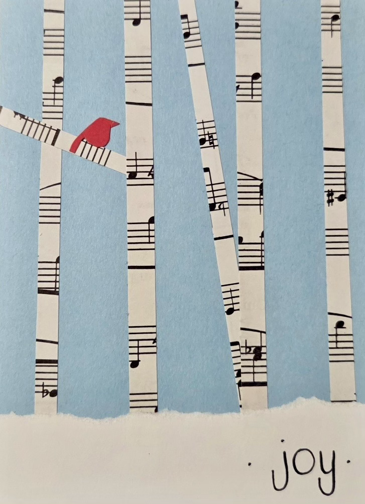 A red bird sits on a branch formed by music notes against a light blue background. Strips of sheet music resemble tree trunks. The word "joy" is written at the bottom.